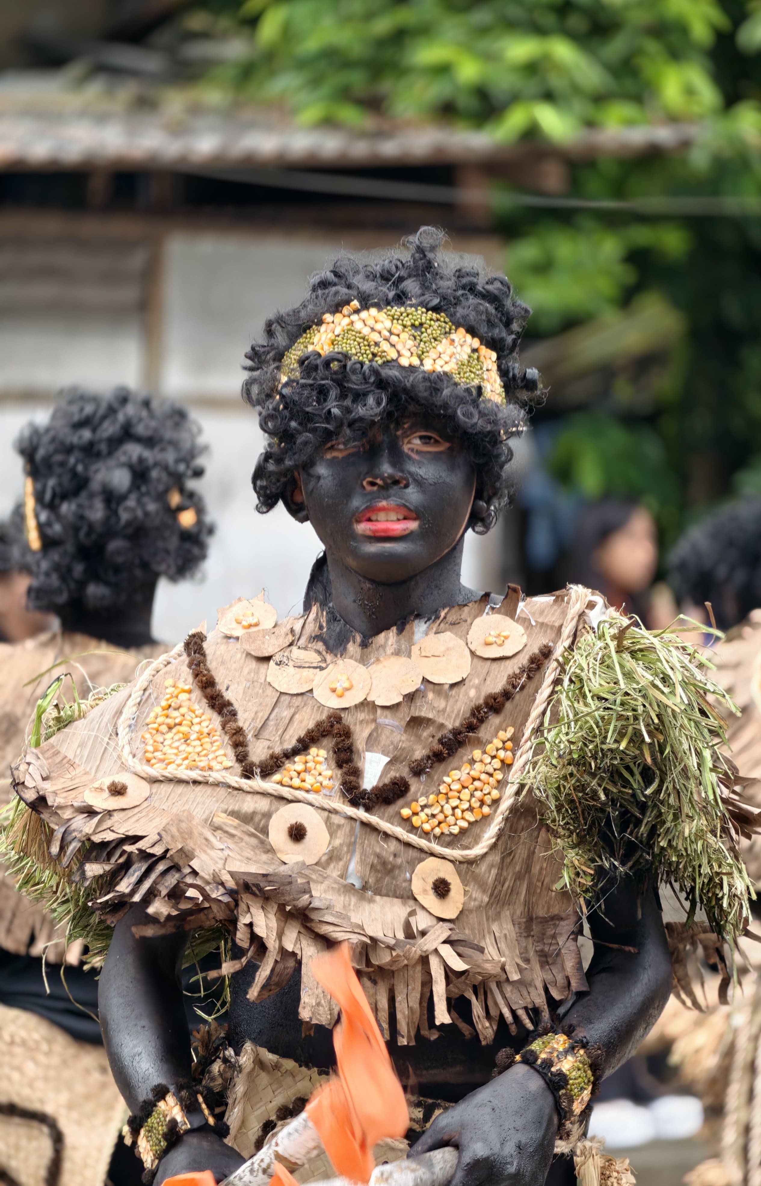 A Guardian in full Ati-Atihan festival regalia, painted and adorned in native Aklan materials.